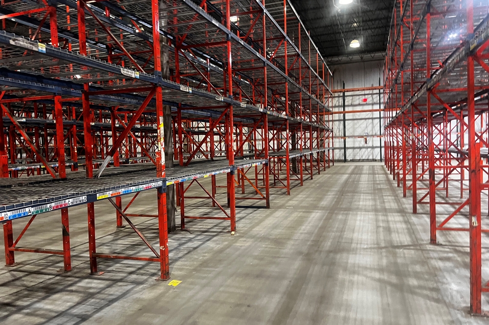 Structural pallet rack beams and columns in used warehouse storage system