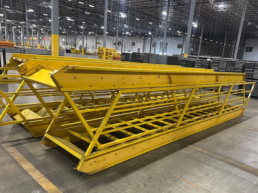 Yellow Mezzanine Staircases liquidated from a facility in Randolph, Massachusetts by American Surplus