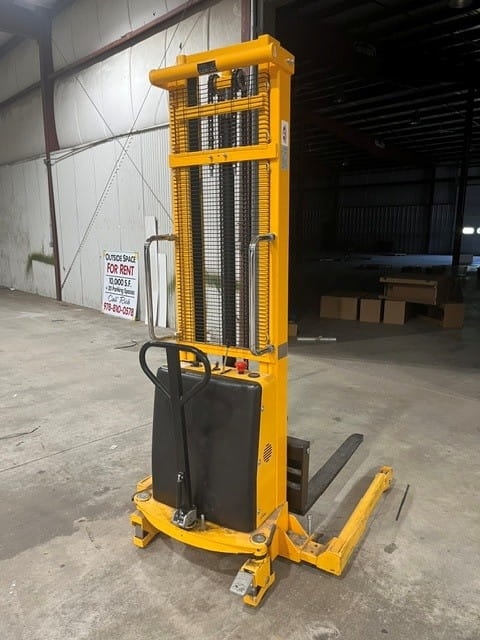Used ULine H-5440 Straddle Stacker liquidated from a facility in Ipswich, Massachusetts by American Surplus