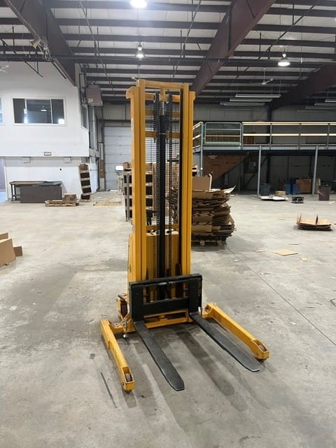 Used ULine H-5440 Straddle Stacker liquidated from a facility in Ipswich, Massachusetts by American Surplus
