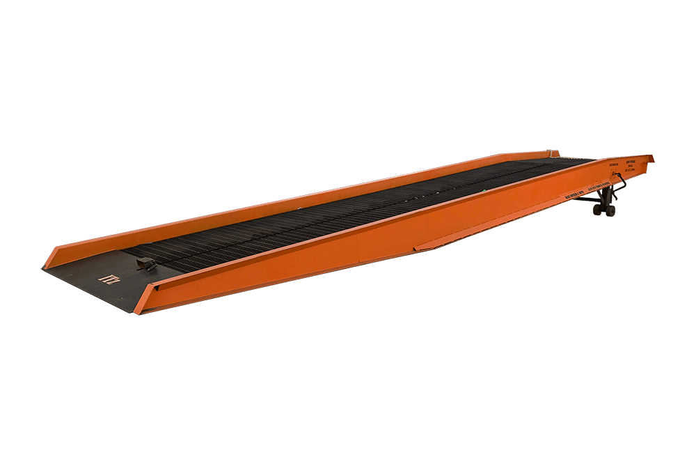 Orange mobile yard ramp with side safety curbs and bar grate decking, designed for forklift loading and unloading operations