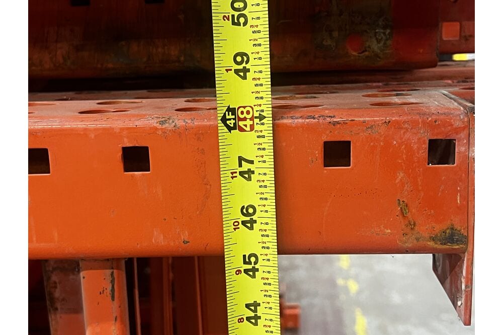 Images of disassembled teardrop pallet racking material liquidated from a warehouse in Newburyport, Massachusetts