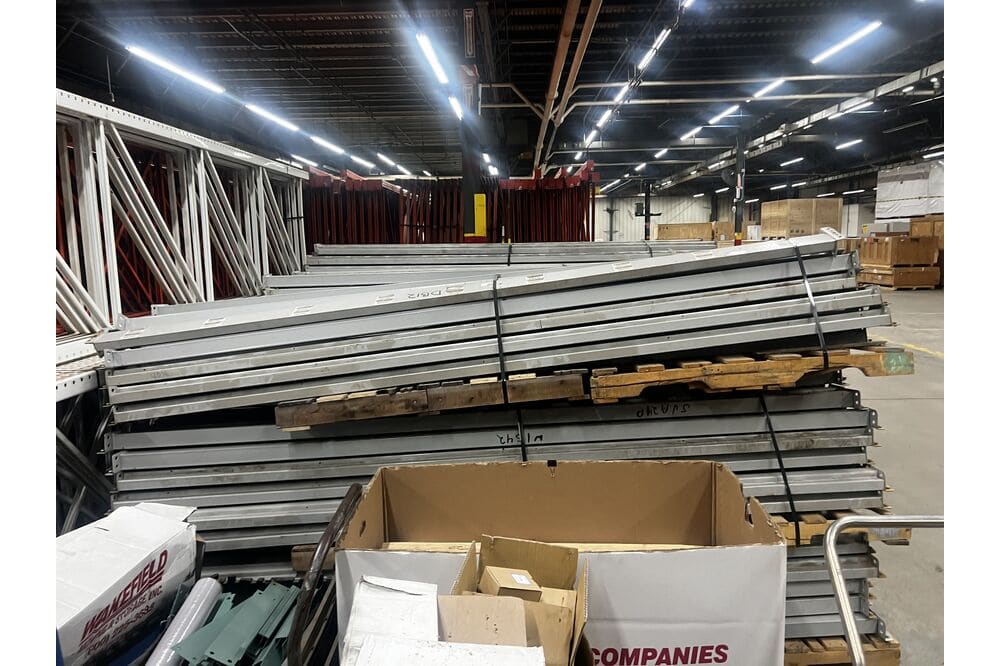 Images of disassembled teardrop pallet racking material liquidated from a warehouse in Newburyport, Massachusetts