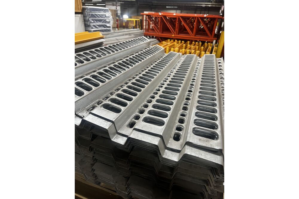 Images of disassembled teardrop pallet racking material liquidated from a warehouse in Newburyport, Massachusetts