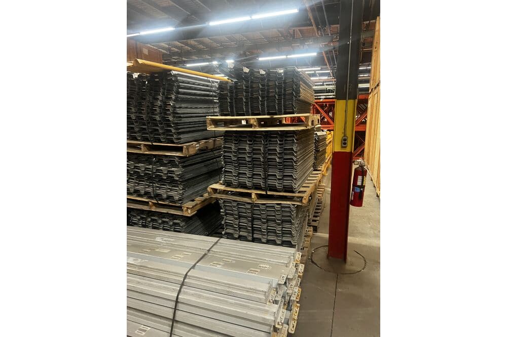 Images of disassembled teardrop pallet racking material liquidated from a warehouse in Newburyport, Massachusetts