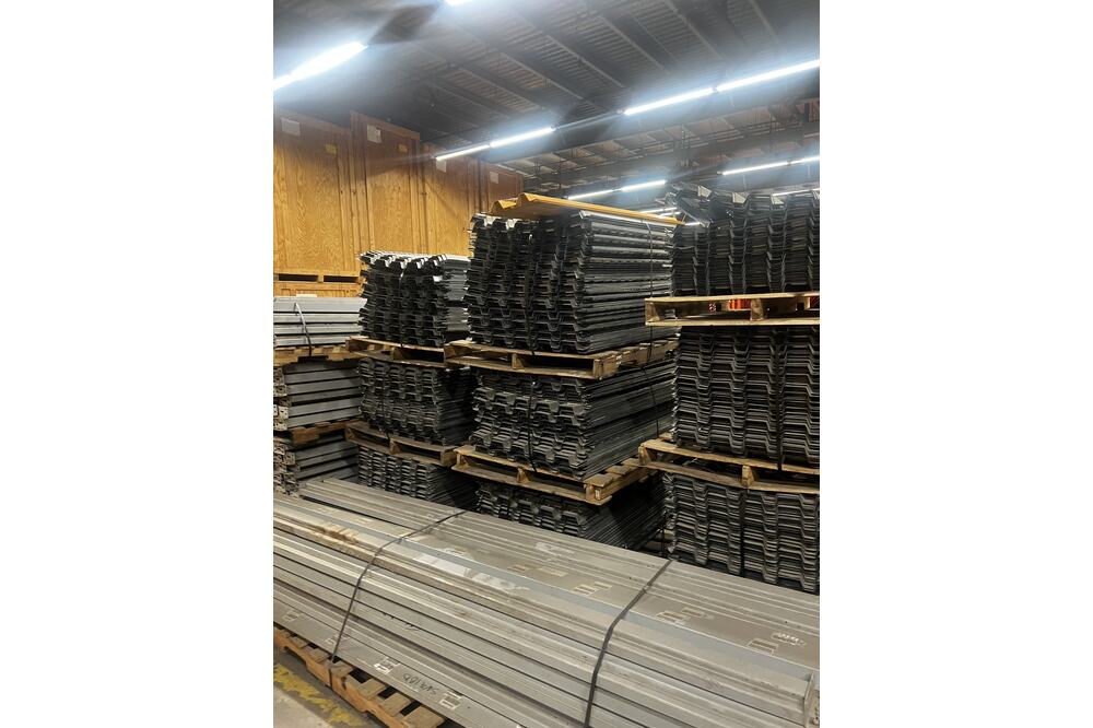 Images of disassembled teardrop pallet racking material liquidated from a warehouse in Newburyport, Massachusetts