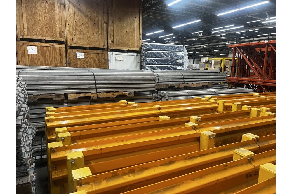 Images of disassembled teardrop pallet racking material liquidated from a warehouse in Newburyport, Massachusetts