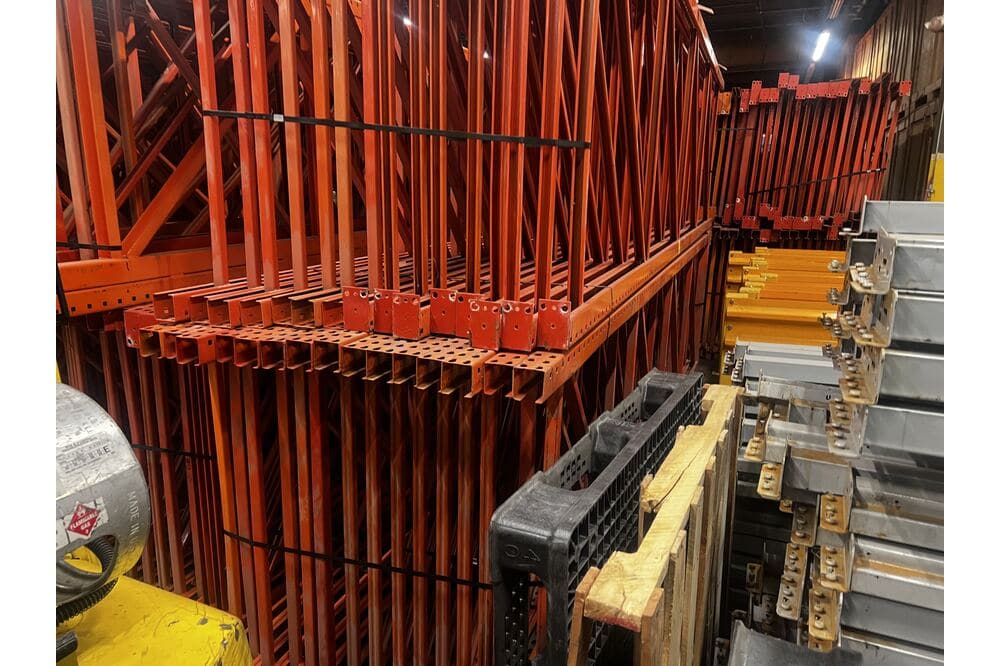 Images of disassembled teardrop pallet racking material liquidated from a warehouse in Newburyport, Massachusetts