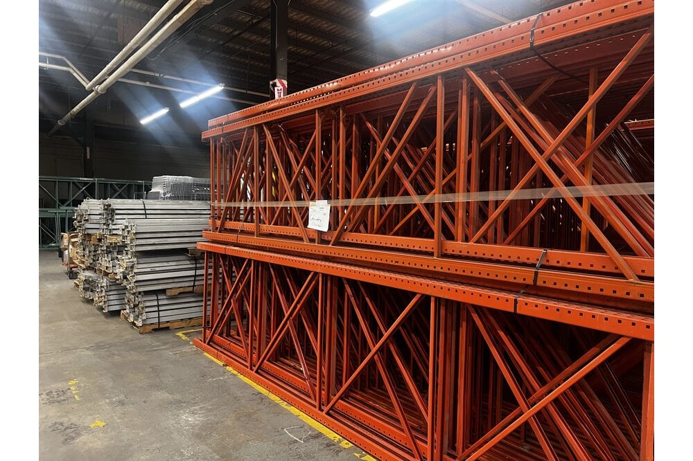 Images of disassembled teardrop pallet racking material liquidated from a warehouse in Newburyport, Massachusetts