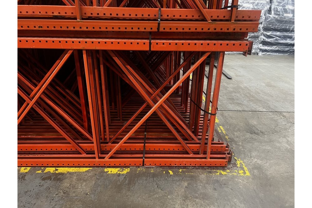 Images of disassembled teardrop pallet racking material liquidated from a warehouse in Newburyport, Massachusetts