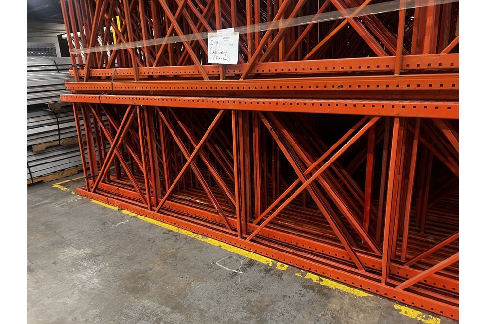 Images of disassembled teardrop pallet racking material liquidated from a warehouse in Newburyport, Massachusetts