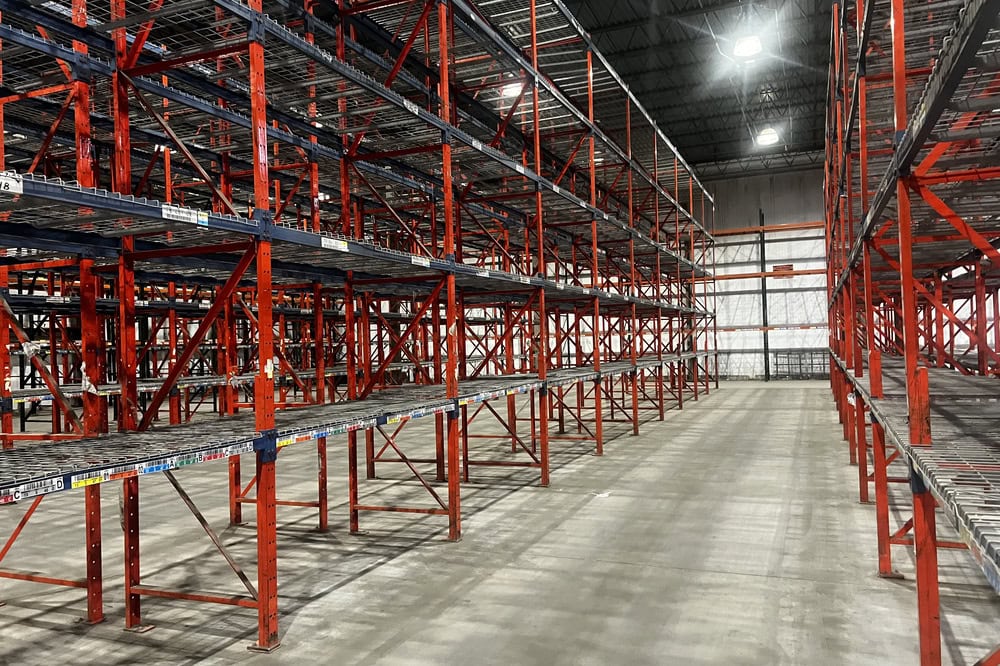 Industrial grade structural rack frames with corrosion resistant finish in warehouse setting