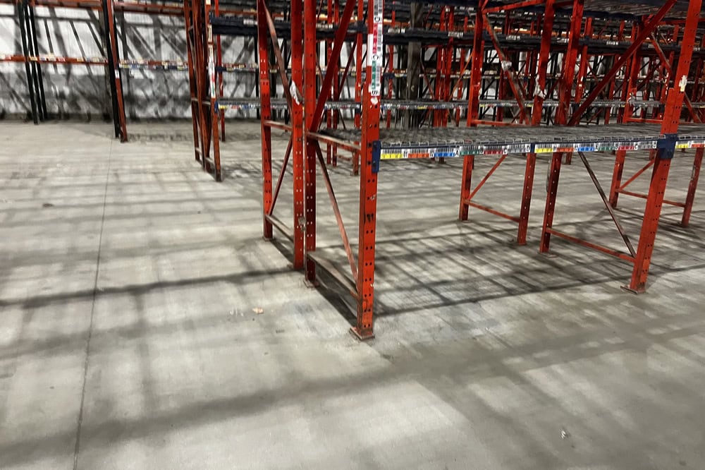 Structural pallet racking system with wire decking panels for carton and bulk material storage