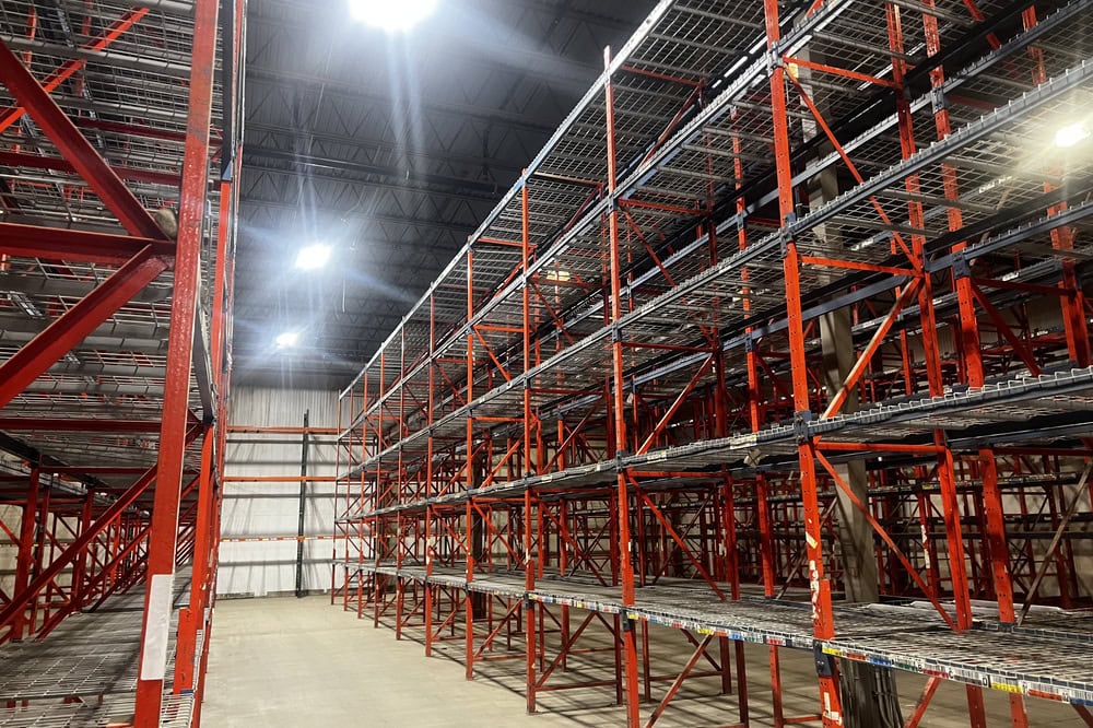 Multi-level structural racking bays ready for installation at material handling facility