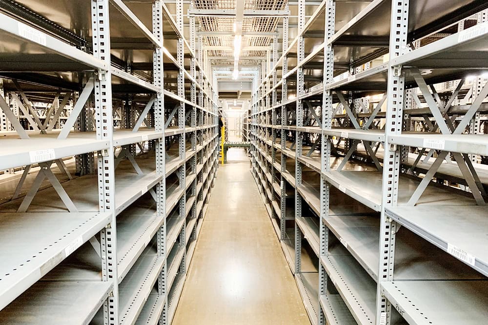 Used industrial clip steel shelving available at American Surplus. Heavy-duty metal shelving units in various depths for warehouse and distribution center storage.