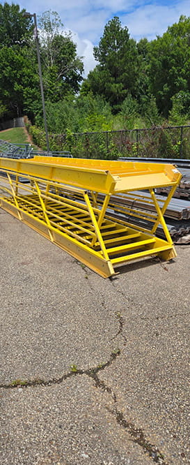 Yellow Mezzanine Staircases liquidated from a facility in Randolph, Massachusetts by American Surplus